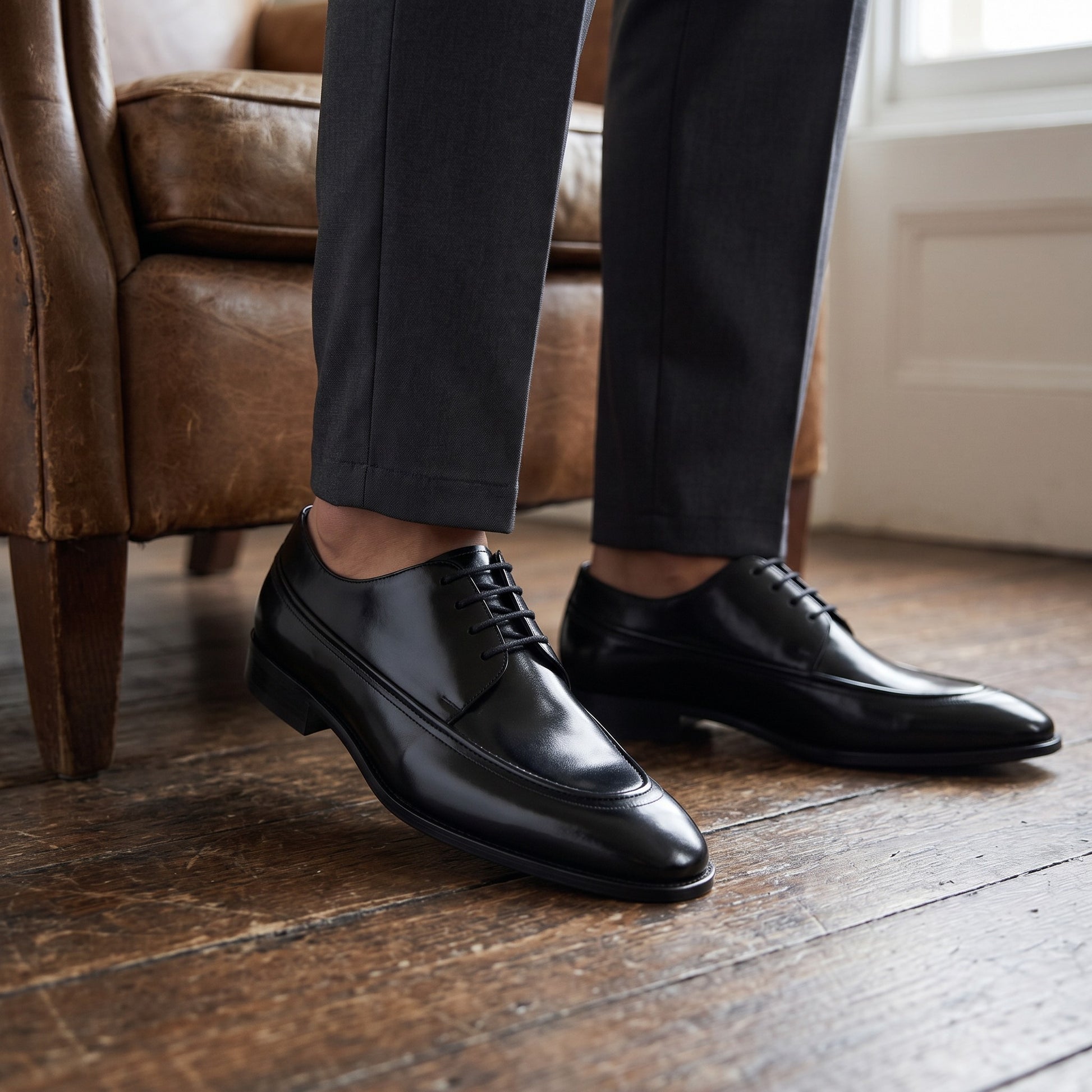 Aryaki black leather apron-toe formal shoes with a polished finish and lace-up closure.
