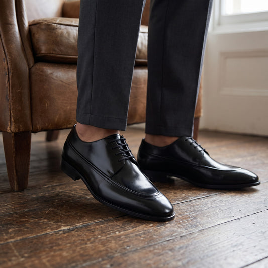 Aryaki black leather apron-toe formal shoes with a polished finish and lace-up closure.