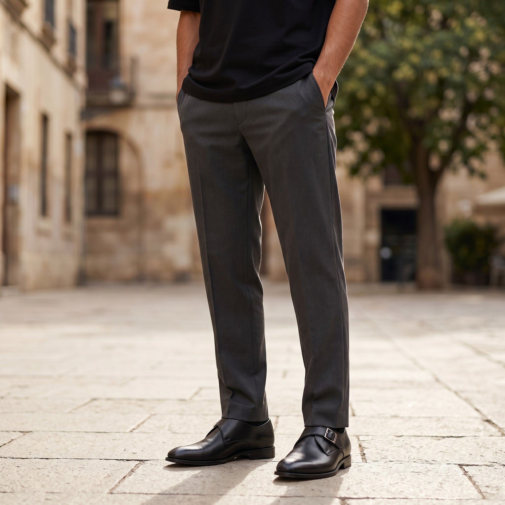 Aryaki black leather single strap monk shoe with silver buckle and textured finish.